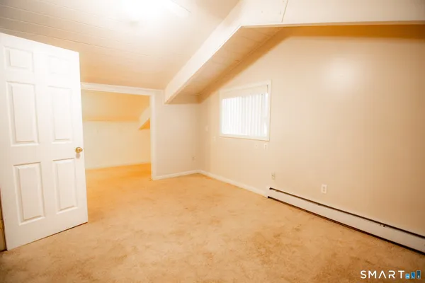 an empty room with a empty space and a window