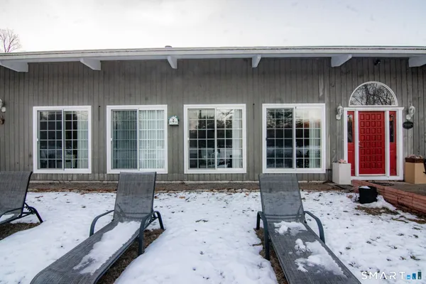 a front view of house with outdoor seating