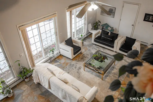 a living room with furniture and a flat screen tv