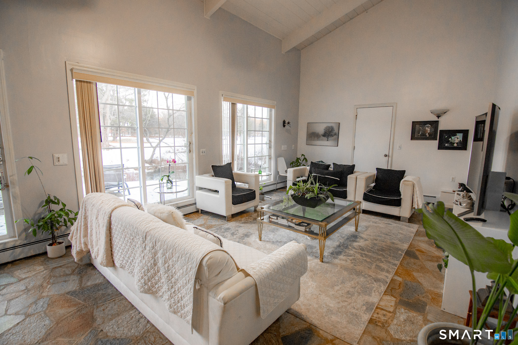 545 Church Street Naugatuck, CT 06770 - Photo 4 of 25 a living room with furniture large window and a flat screen tv