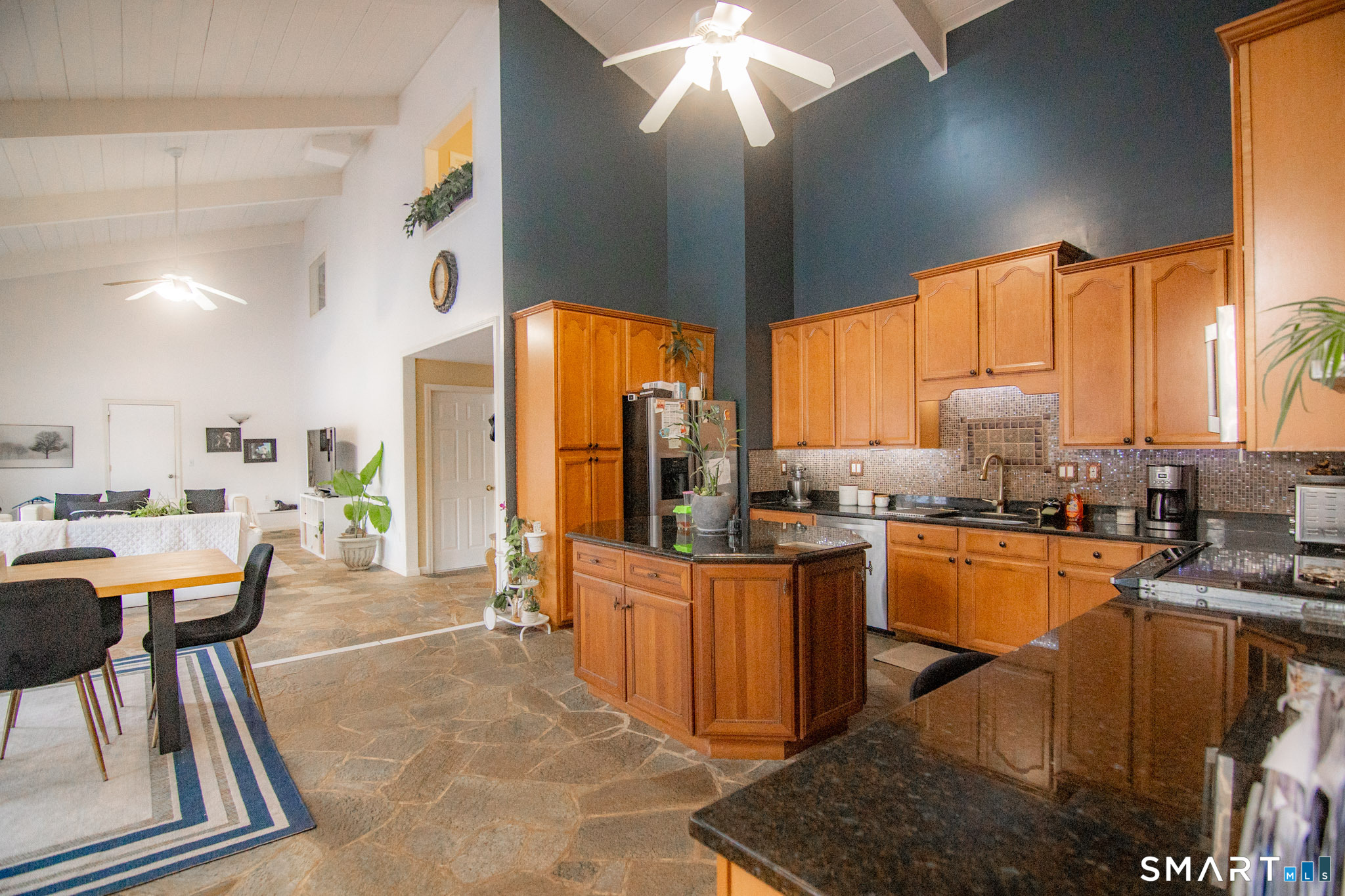 545 Church Street Naugatuck, CT 06770 - Photo 10 of 25 a kitchen with stainless steel appliances granite countertop sink stove and refrigerator