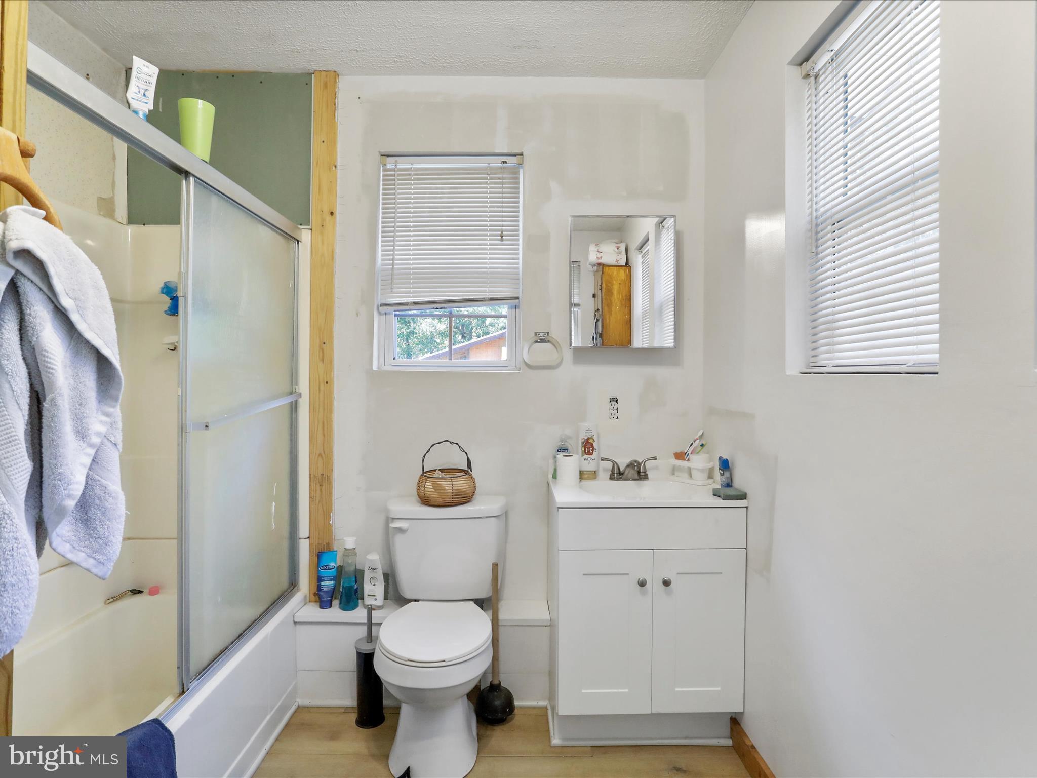 2370 Kerns School Road Springfield, WV 26763 - Photo 23 of 45 a bathroom with a sink toilet and shower
