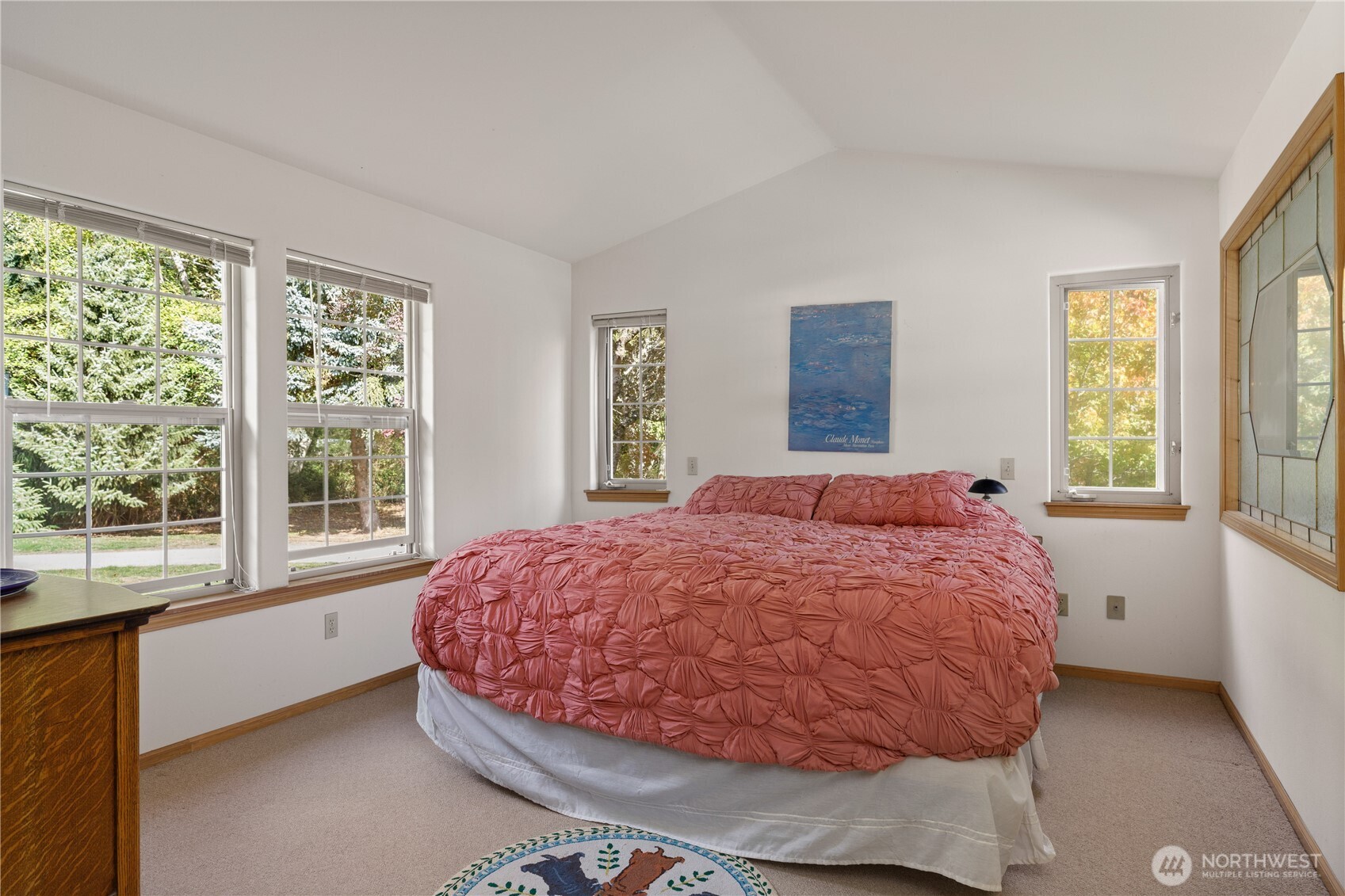 5474 Wilkinson Road Langley, WA 98260 - Photo 13 of 40 a bedroom with a bed and a large window