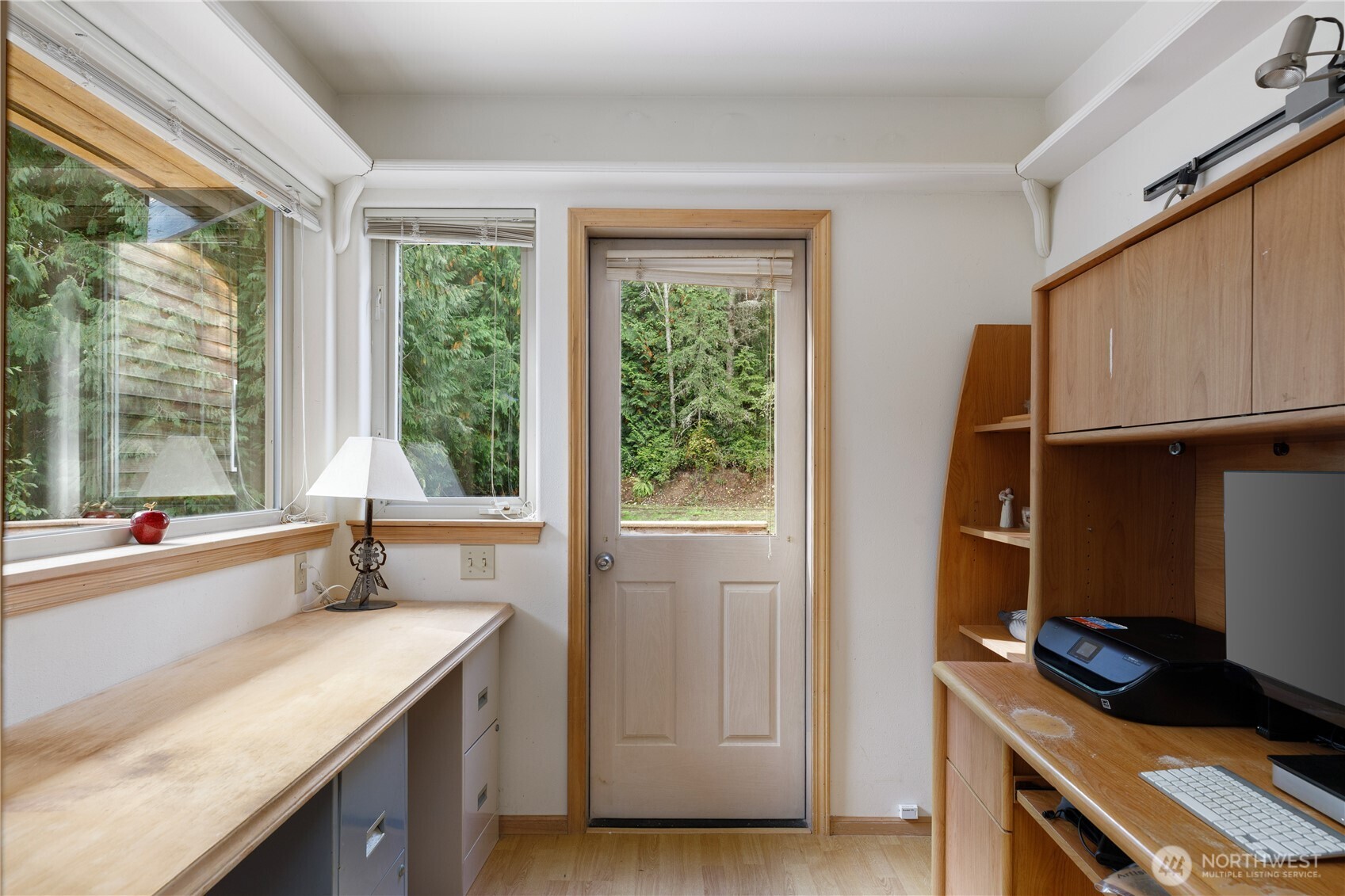 5474 Wilkinson Road Langley, WA 98260 - Photo 17 of 40 a room with a window a sink and a cabinets