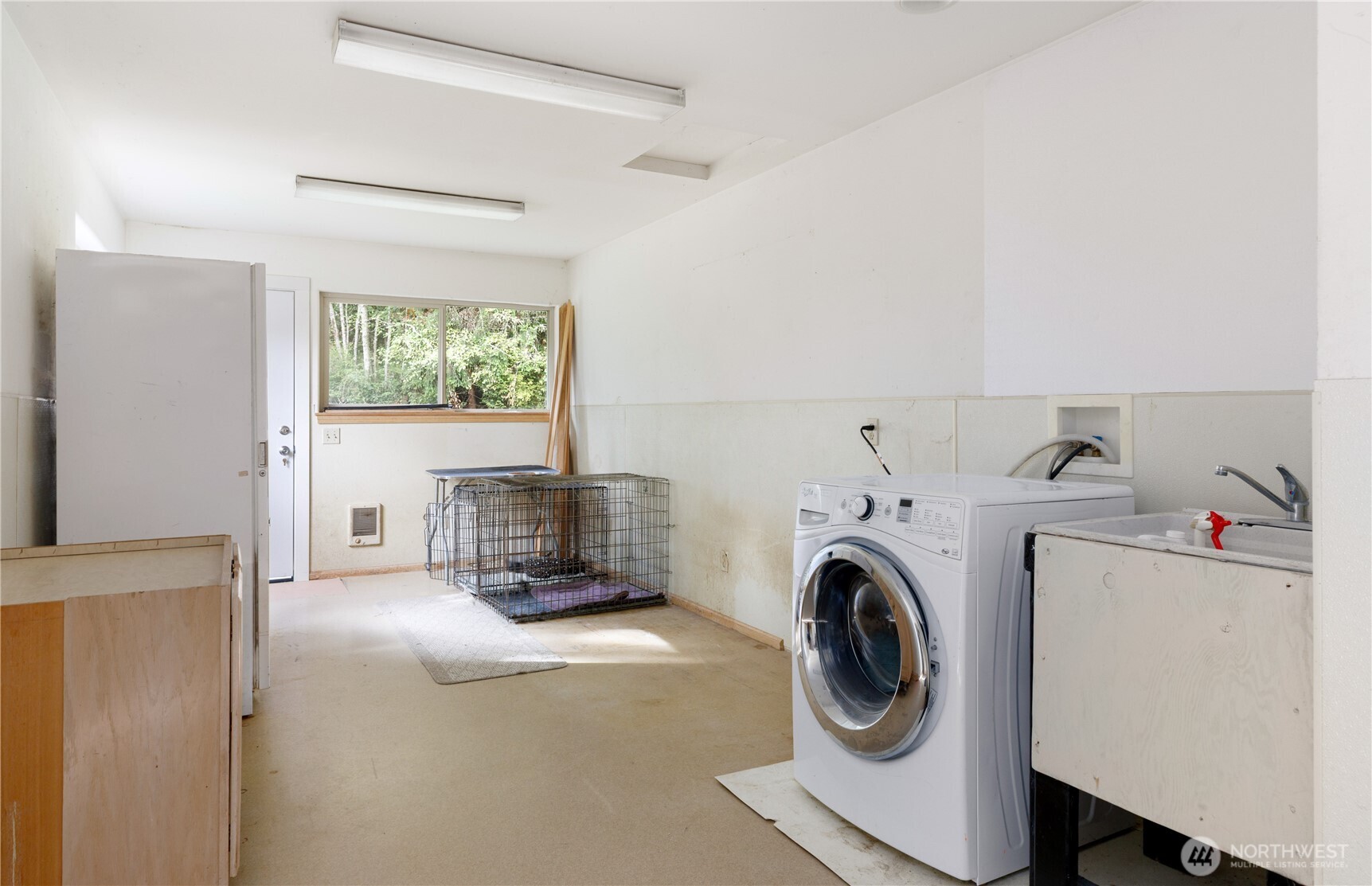 5474 Wilkinson Road Langley, WA 98260 - Photo 19 of 40 a view of a storage and utility room with washer and dryer
