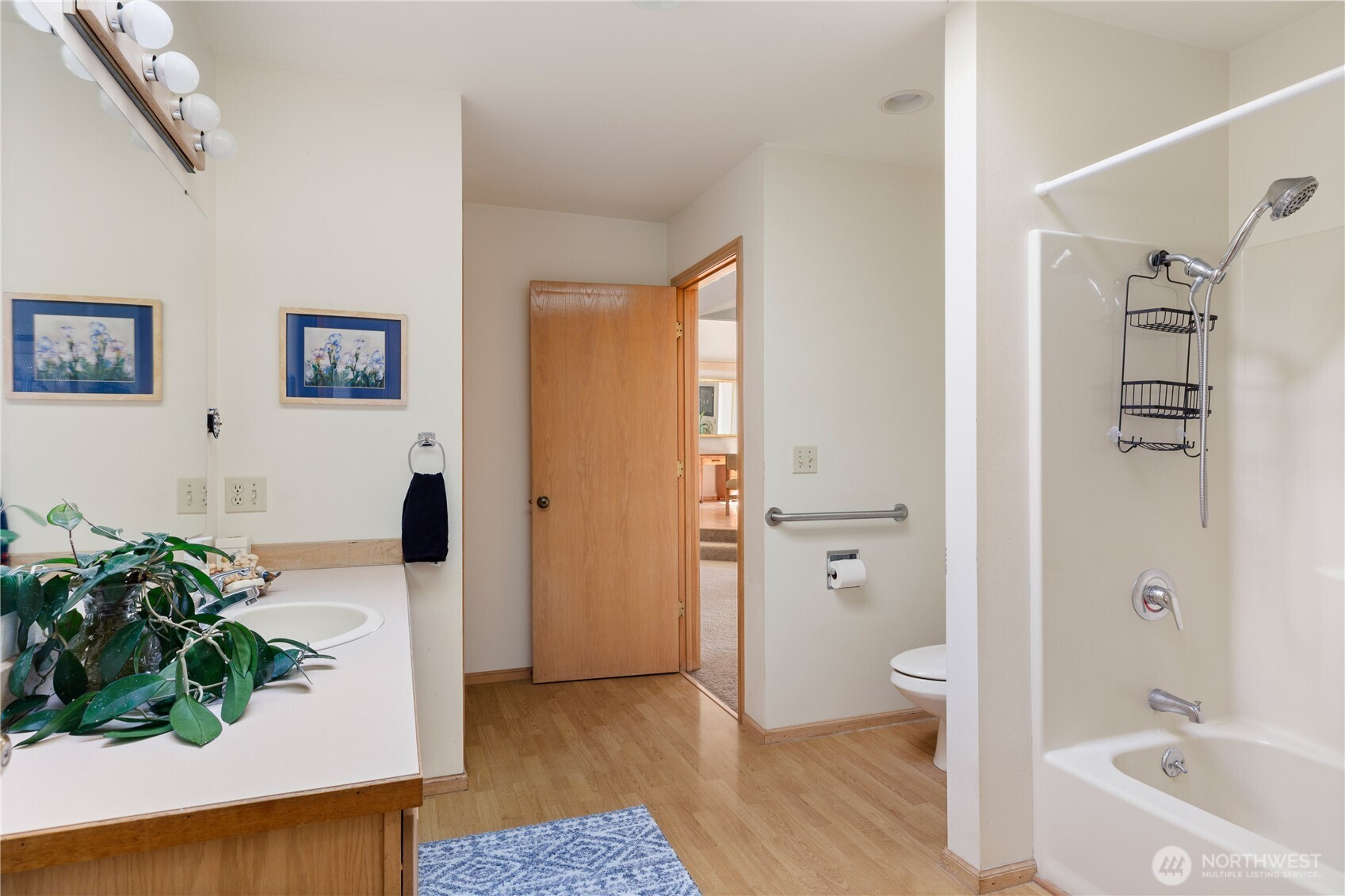 5474 Wilkinson Road Langley, WA 98260 - Photo 20 of 40 a bathroom with a tub shower and toilet