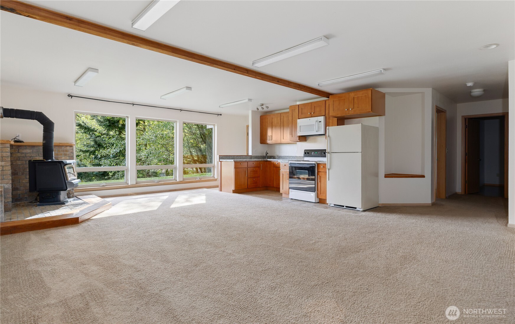 5474 Wilkinson Road Langley, WA 98260 - Photo 21 of 40 a view of a livingroom with furniture and a fireplace