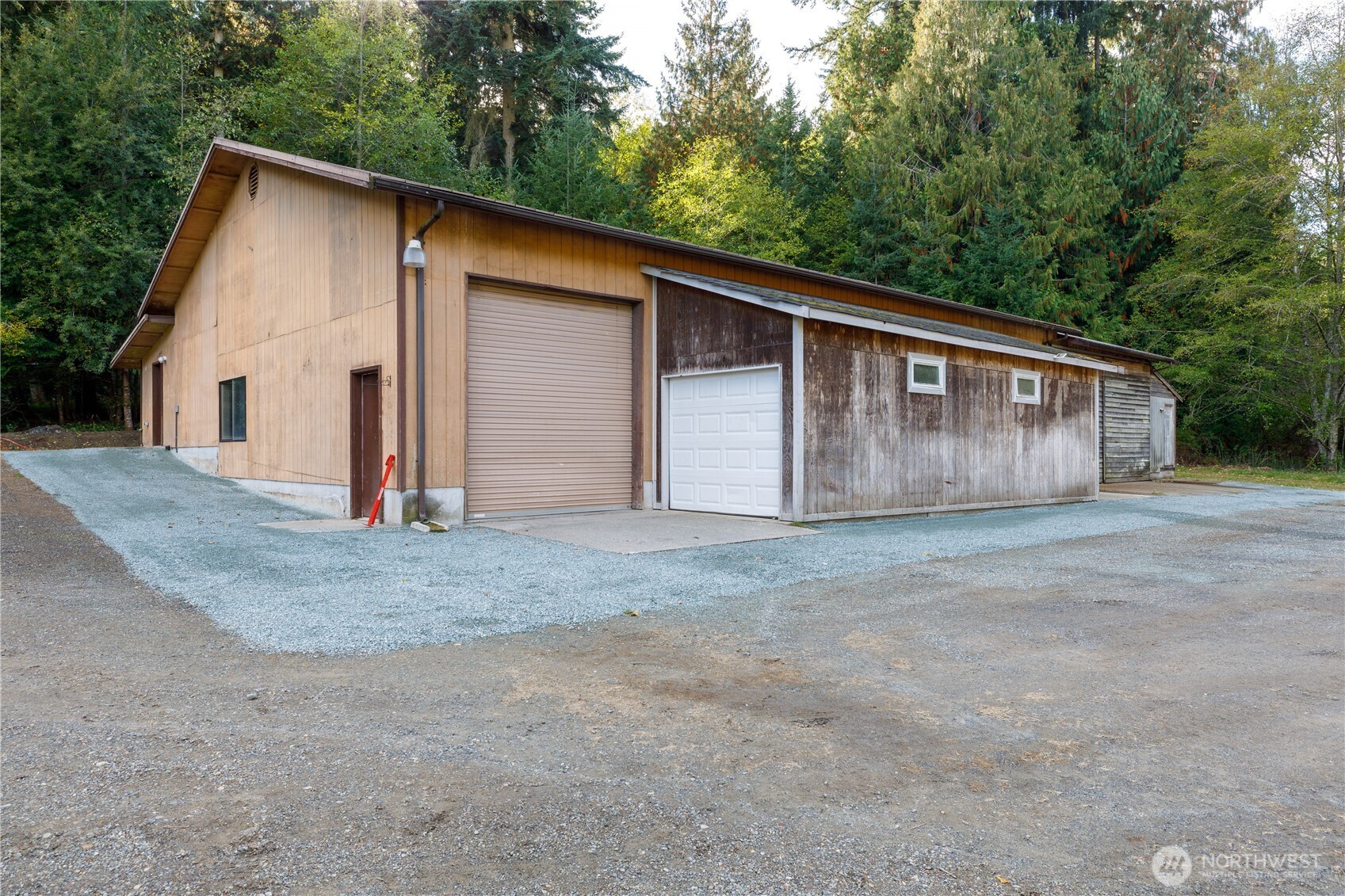 5474 Wilkinson Road Langley, WA 98260 - Photo 33 of 40 a view of a house with a backyard and garage
