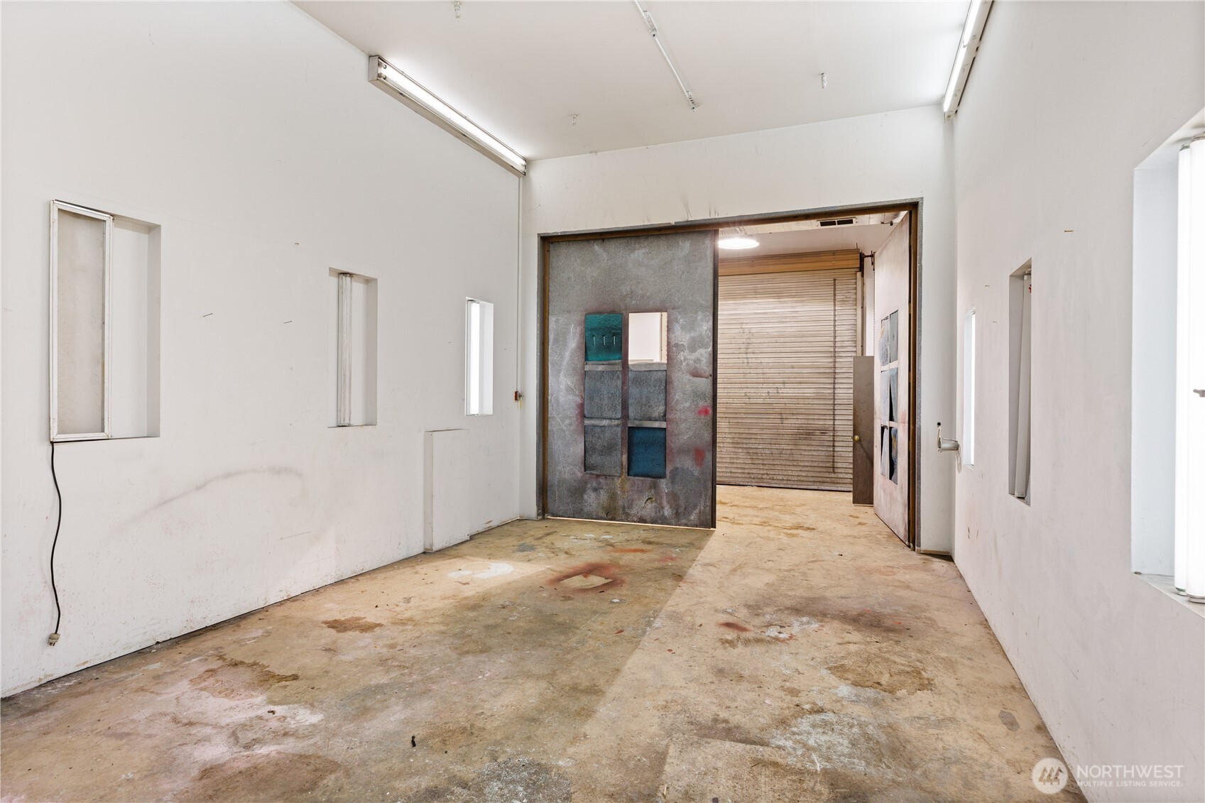 5474 Wilkinson Road Langley, WA 98260 - Photo 37 of 40 a view of a big room with closet and wooden floor
