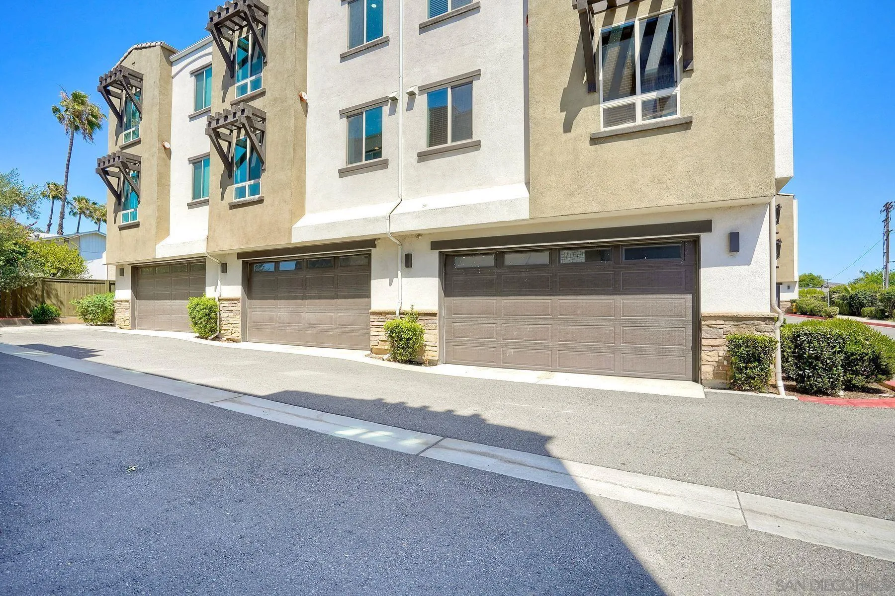 8850 Olive Lane, Unit 7 Santee, CA 92071 - Photo 26 of 27 a front view of a house with a road