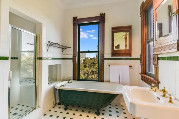 a bathroom with a bathtub and shower