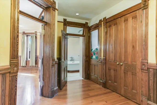 a bathroom with a shower and a glass door