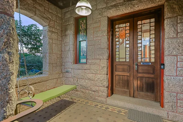 a view of a door and wooden floor