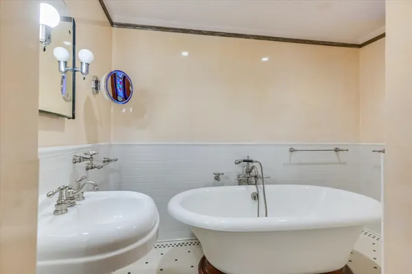 a bathroom with a sink and mirror