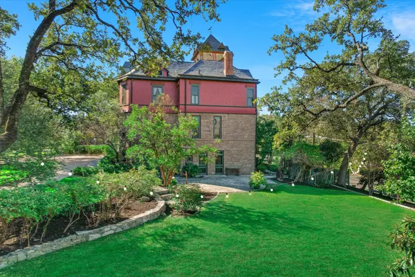 a view of a city with lush green forest