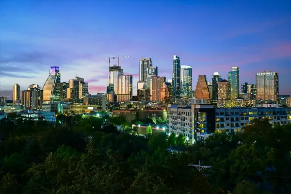 a view of a city with tall buildings