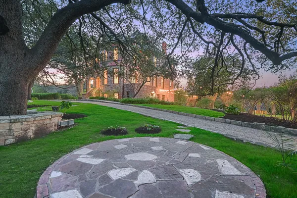 a view of a park with large trees