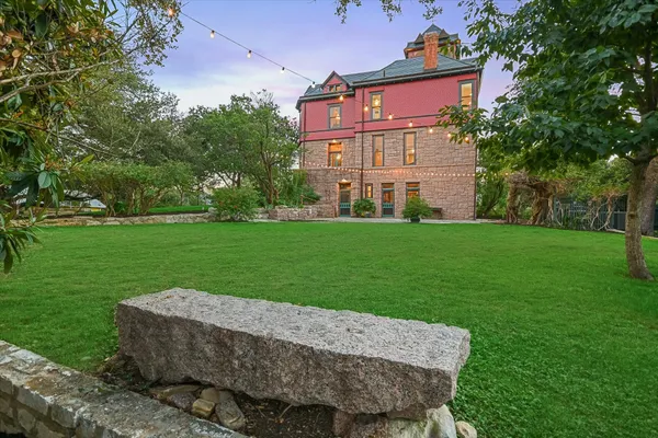 a view of a house with a yard