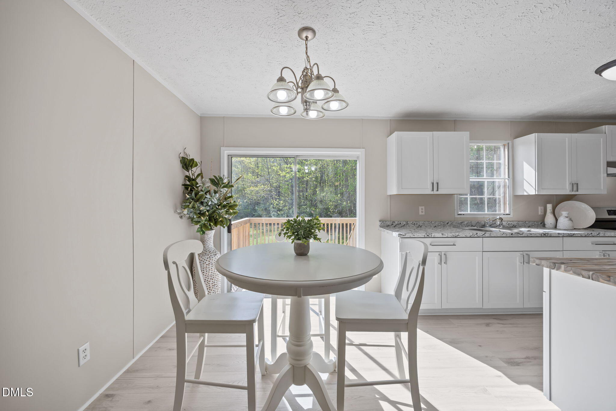 721 General Green Road Kittrell, NC 27544 - Photo 10 of 36 a kitchen with a table and chairs in it