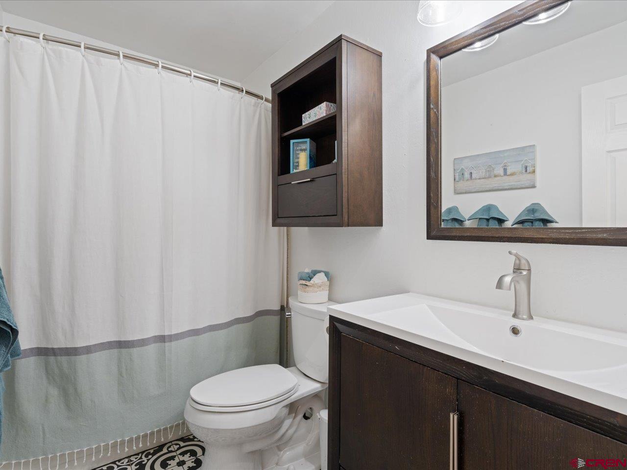 68184 Tumbleweed Road Montrose, CO 81403 - Photo 19 of 35 a bathroom with a sink toilet and mirror