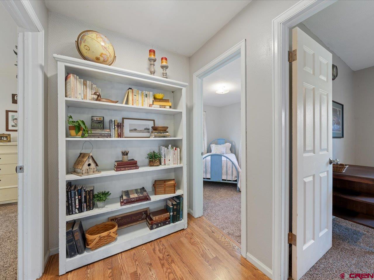 68184 Tumbleweed Road Montrose, CO 81403 - Photo 26 of 35 a view of hallway with livingroom and furniture