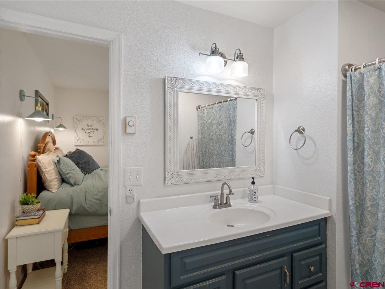 68184 Tumbleweed Road Montrose, CO 81403 - Photo 27 of 35 a bathroom with a sink and a mirror