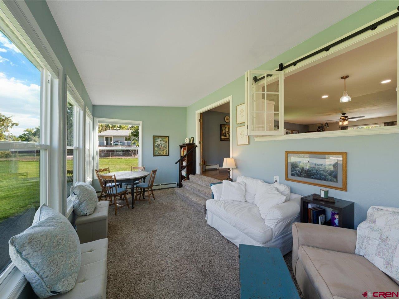 68184 Tumbleweed Road Montrose, CO 81403 - Photo 28 of 35 a living room with furniture and a flat screen tv