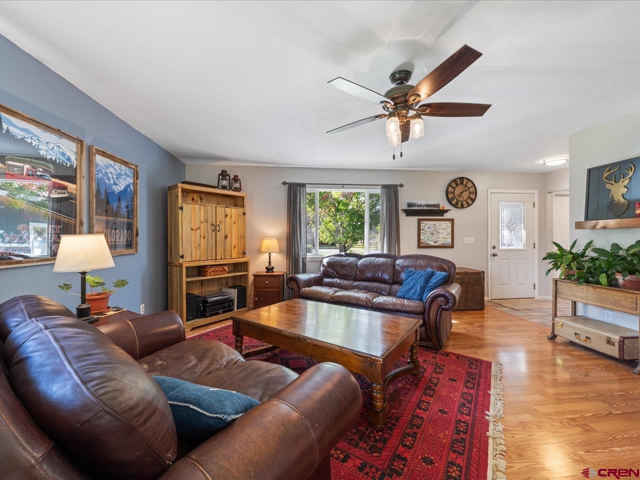68184 Tumbleweed Road Montrose, CO 81403 - Photo 6 of 35 a living room with furniture and a wooden floor