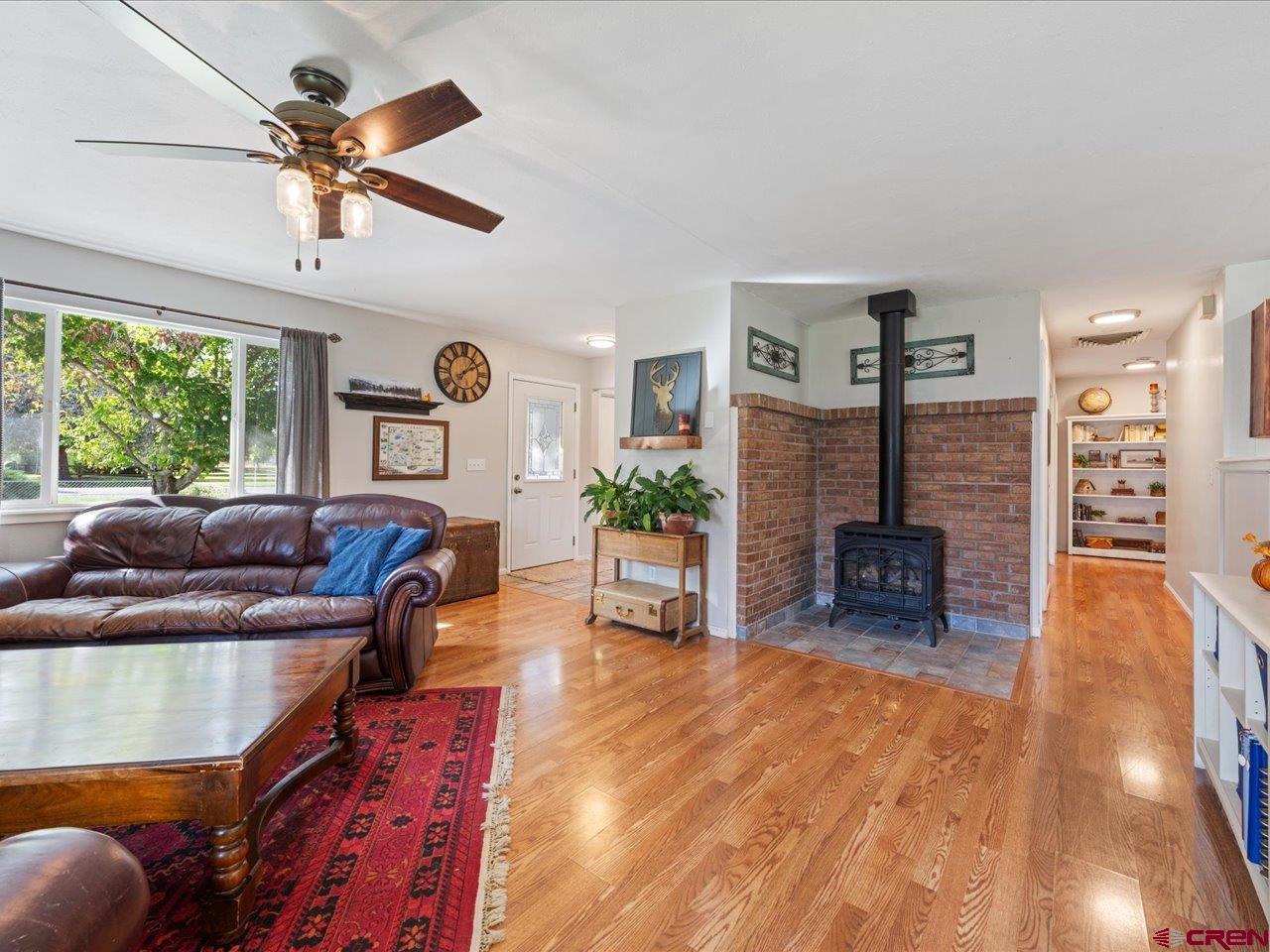 68184 Tumbleweed Road Montrose, CO 81403 - Photo 8 of 35 a living room with furniture and a large window