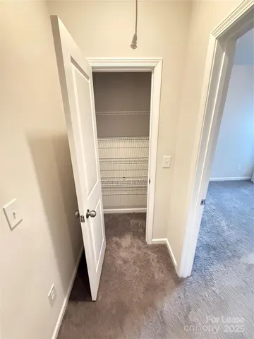 a view of an empty room and glass door