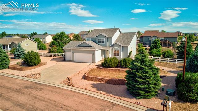 12510 Motley Road Peyton, CO 80831 - Photo 32 of 36 View of front of home with a garage