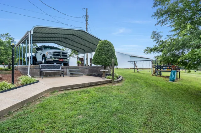 a view of a backyard with sitting area