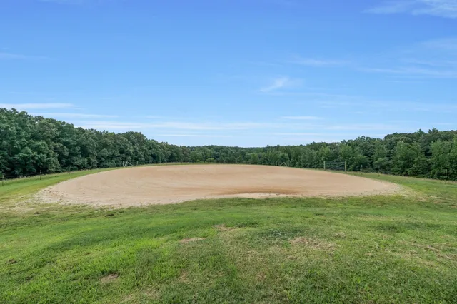 an aerial view of a houses with a yard