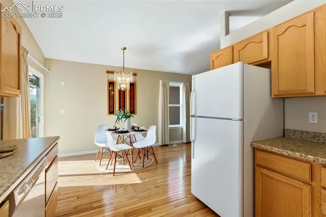a kitchen with a refrigerator a stove top oven a sink and dishwasher