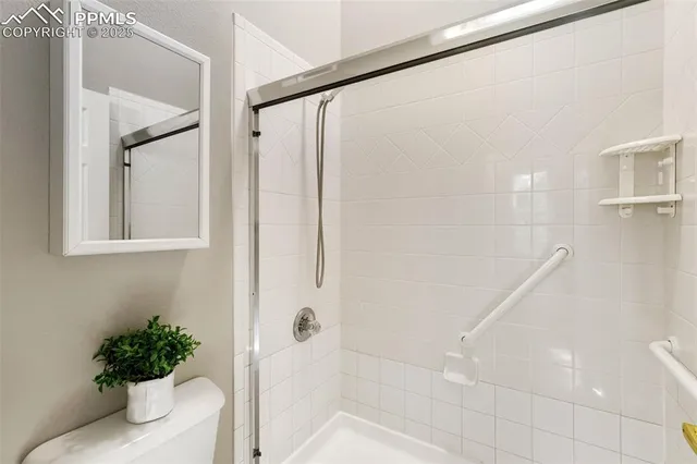 a bathroom with a shower and a tub
