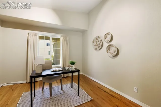 a room with wooden floor and a window