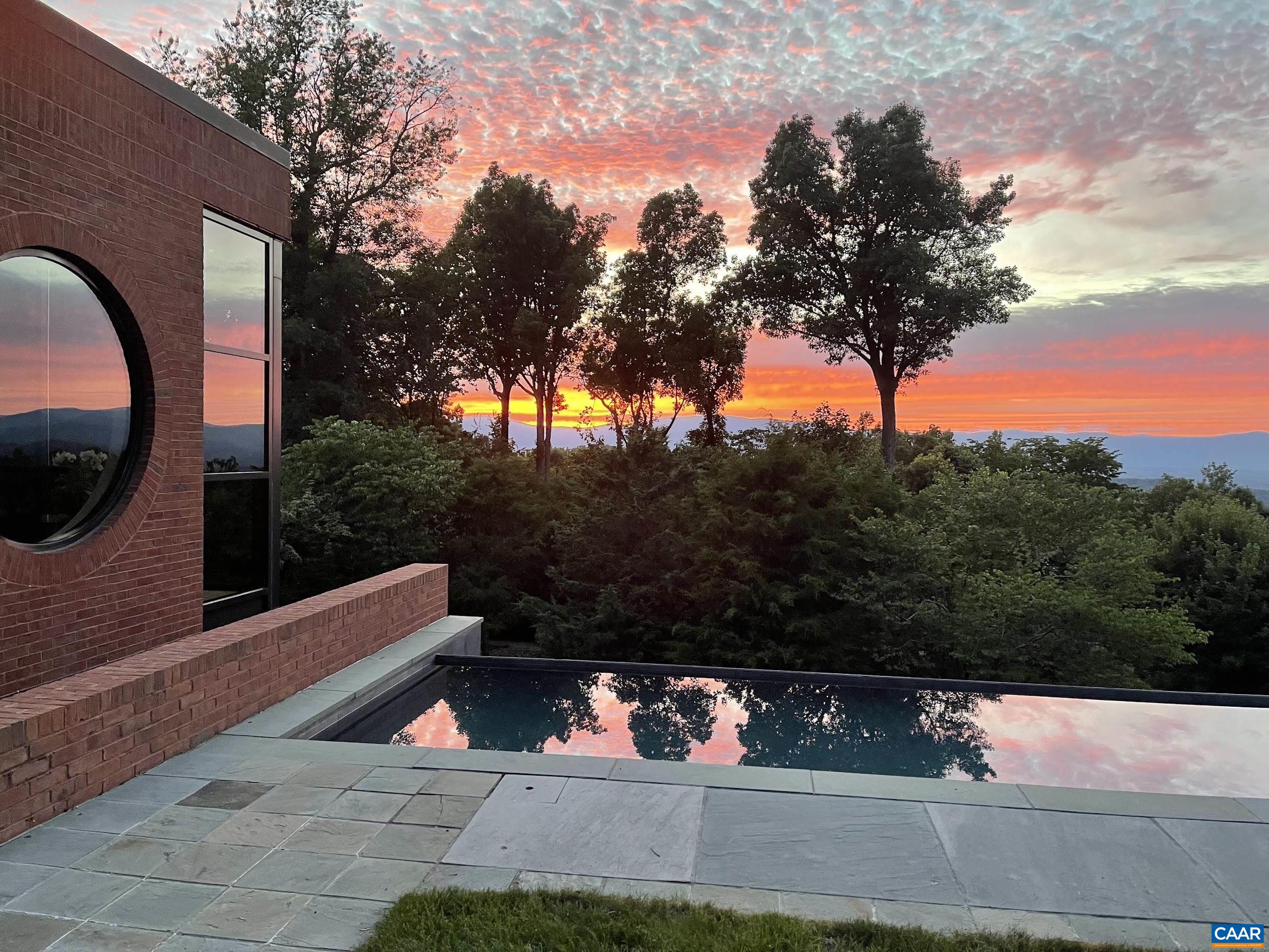 a view of yard with mountain view and wooden floor