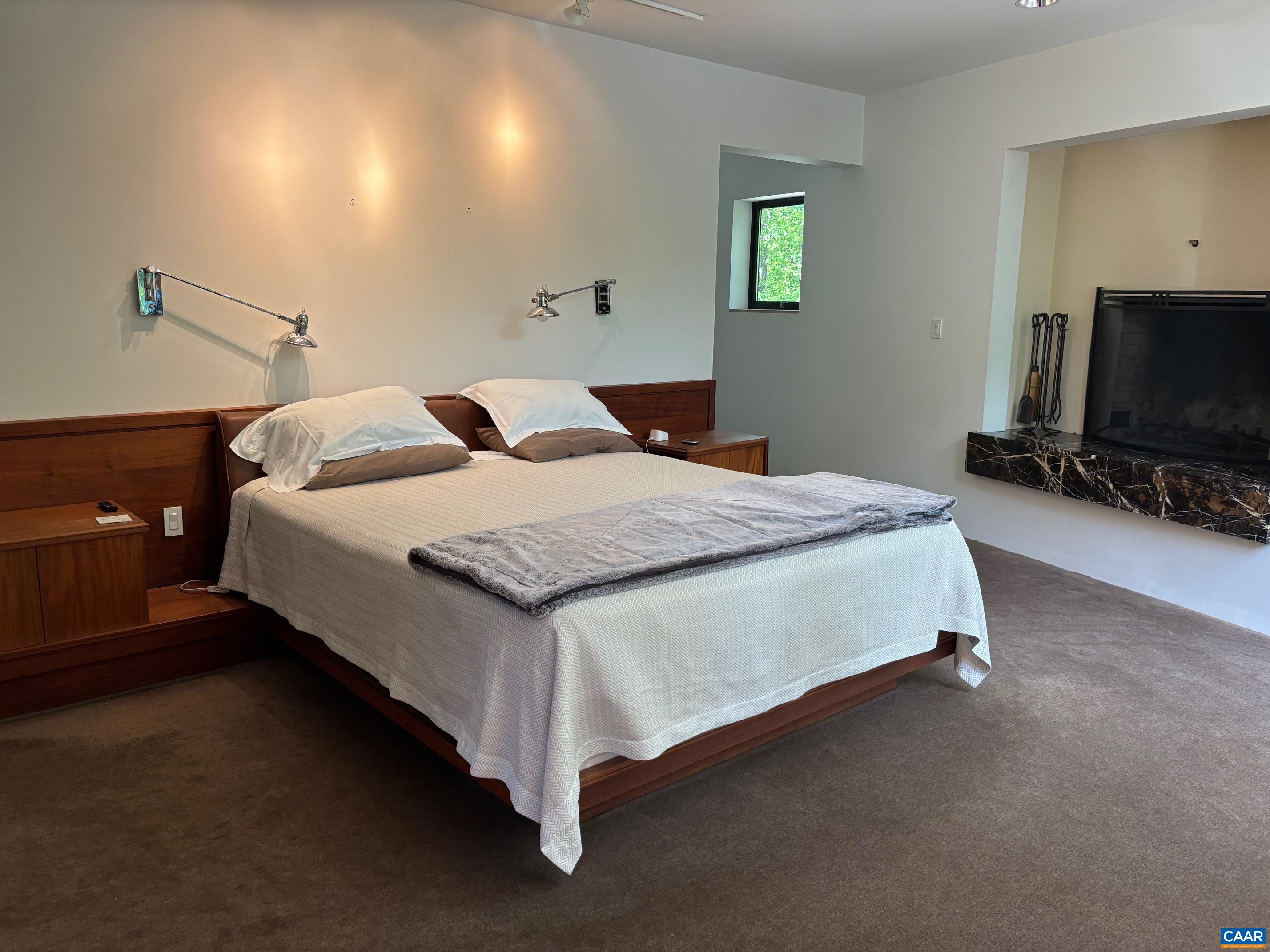 Undisclosed Address Charlottesville, VA 22903 - Photo 11 of 32 a bedroom with a bed and a flat screen tv