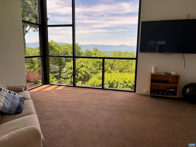 a view of a balcony with wooden floor