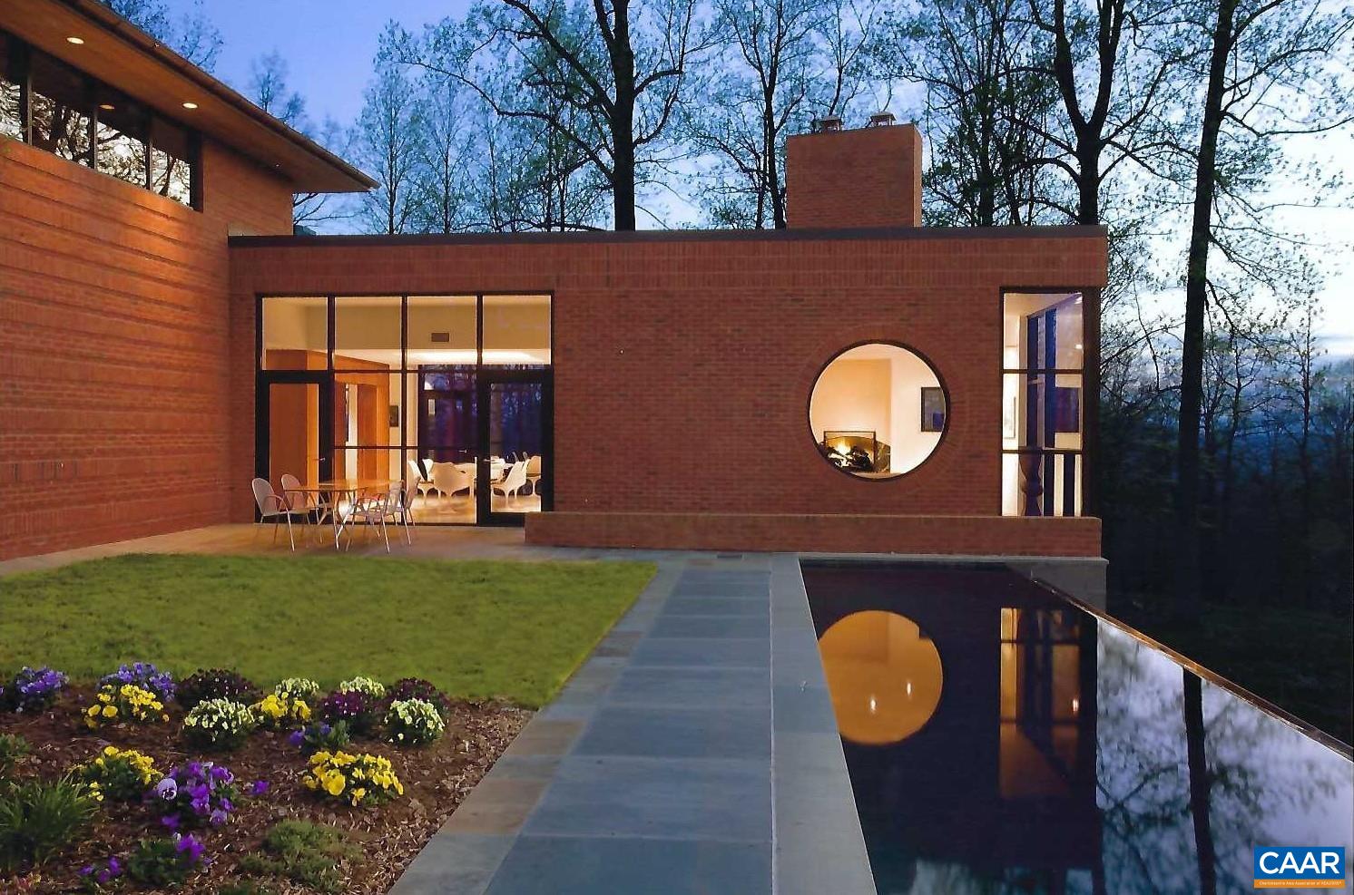 Undisclosed Address Charlottesville, VA 22903 - Photo 2 of 32 a front view of a house with garden