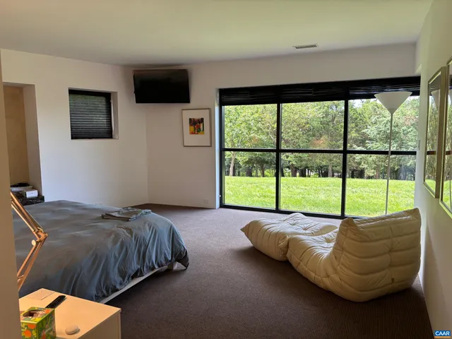 a view of a chair and tables back yard of the house