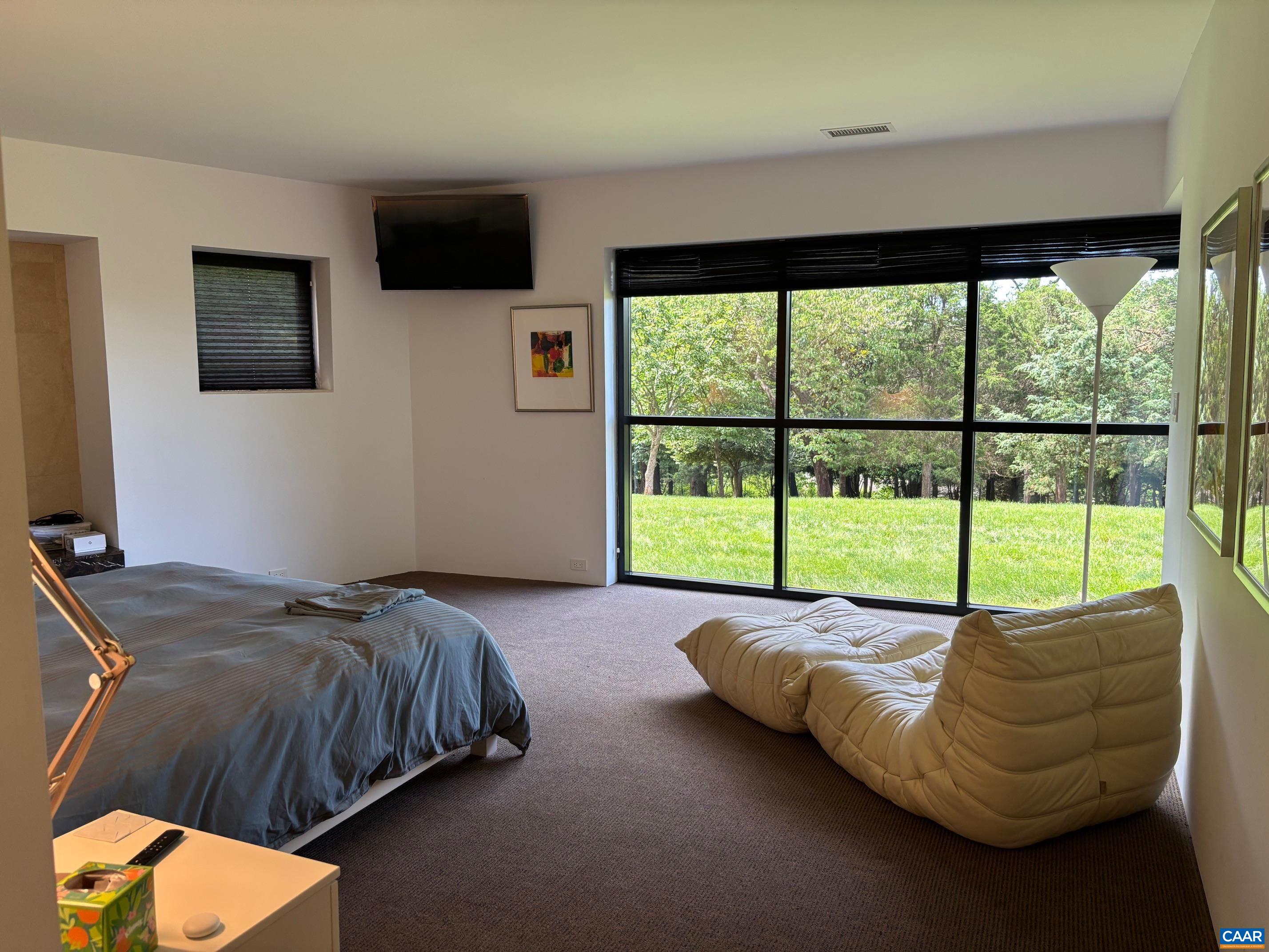 Undisclosed Address Charlottesville, VA 22903 - Photo 23 of 32 a bed sitting in a bedroom next to a window