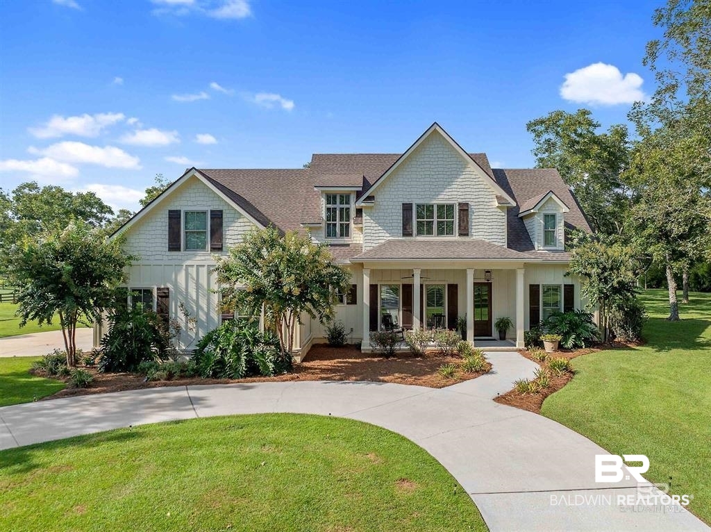 8753 Bishop Road Fairhope, AL 36532 - Photo 8 of 59 View of front of home with a front yard, covered porch, and a shingled roof