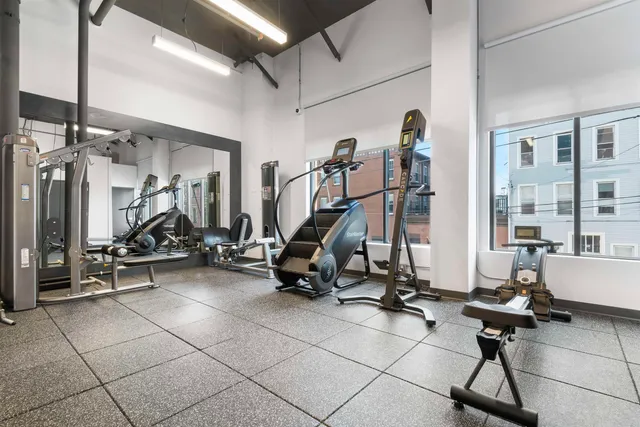 a kitchen with sink a stove and chairs