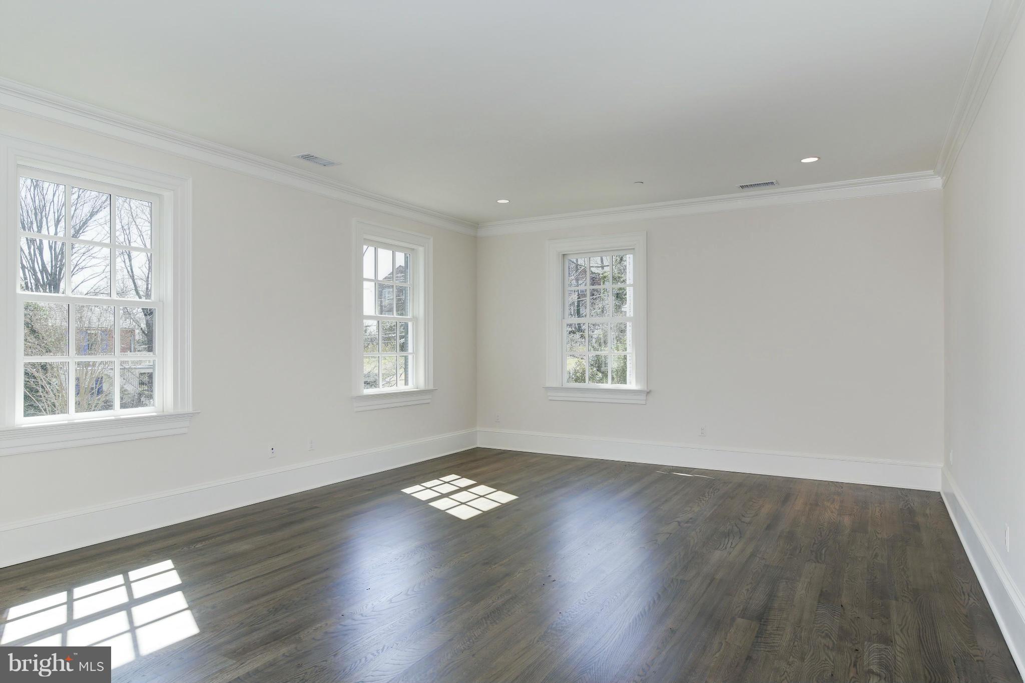 4450 Deerfield Road Washington, DC 20007 - Photo 11 of 28 a view of empty room with wooden floor and fan