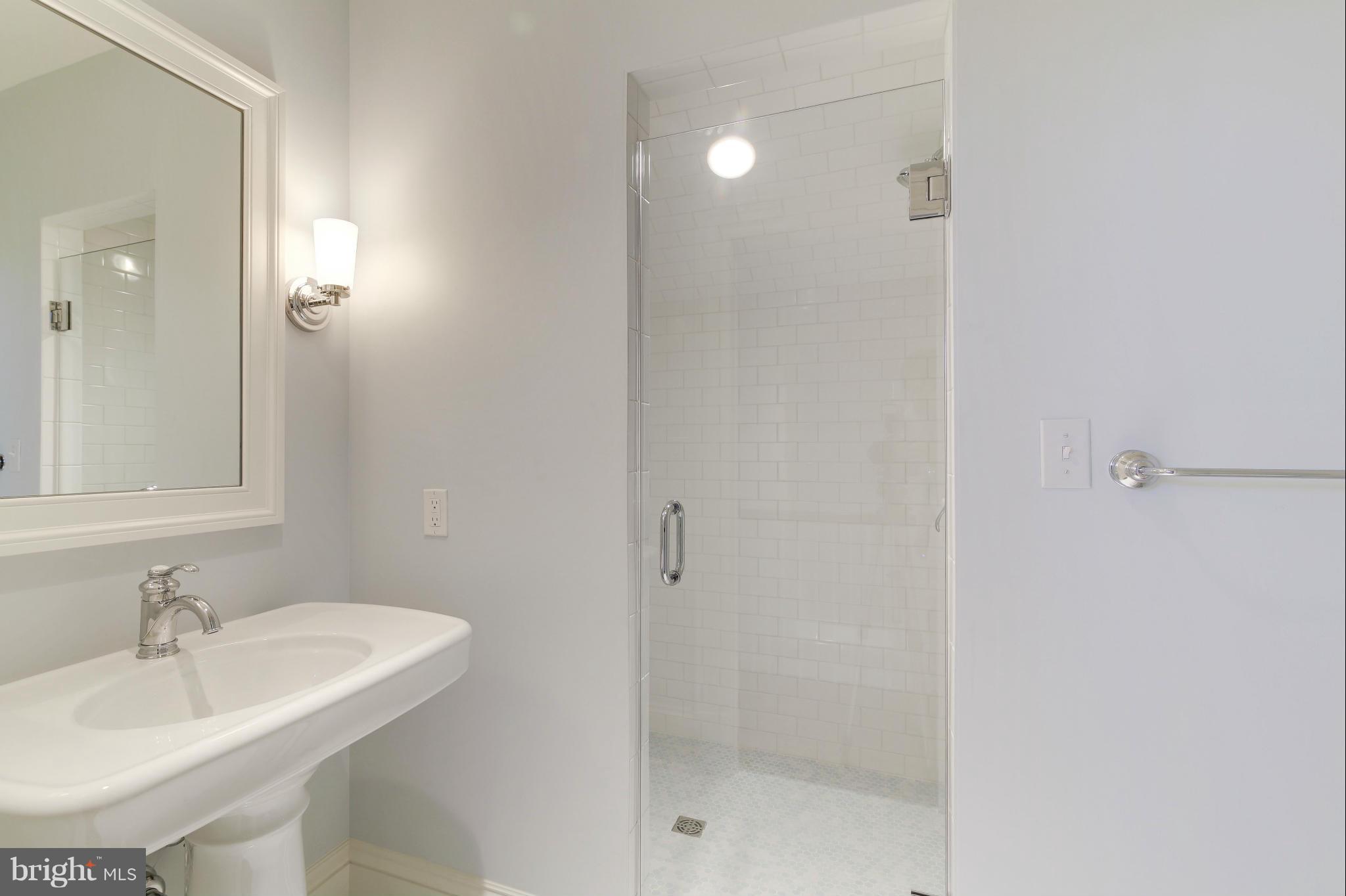 4450 Deerfield Road Washington, DC 20007 - Photo 22 of 28 a bathroom with a sink and a mirror
