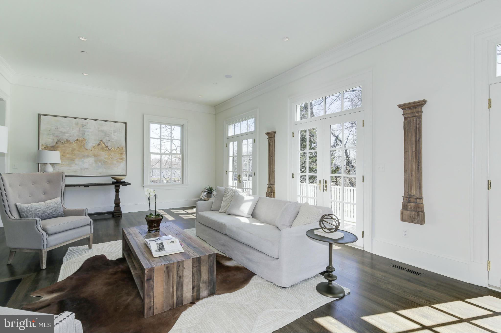 4450 Deerfield Road Washington, DC 20007 - Photo 7 of 28 a living room with furniture wooden floor and a large window