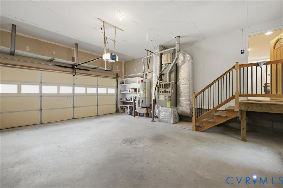 12600 Lilking Road Chester, VA 23831 - Photo 19 of 33 Spacious garage featuring a three-panel sectional