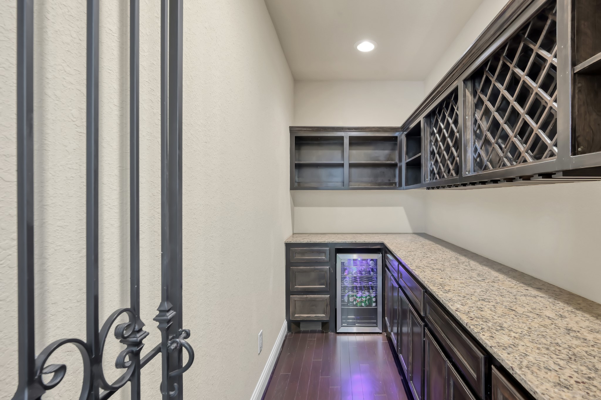23 Rancher's Trail Tomball, TX 77375 - Photo 14 of 40 This inviting space offers a versatile wine grotto that's spacious enough to double as a stylish home office, seamlessly blending functionality with luxury.
