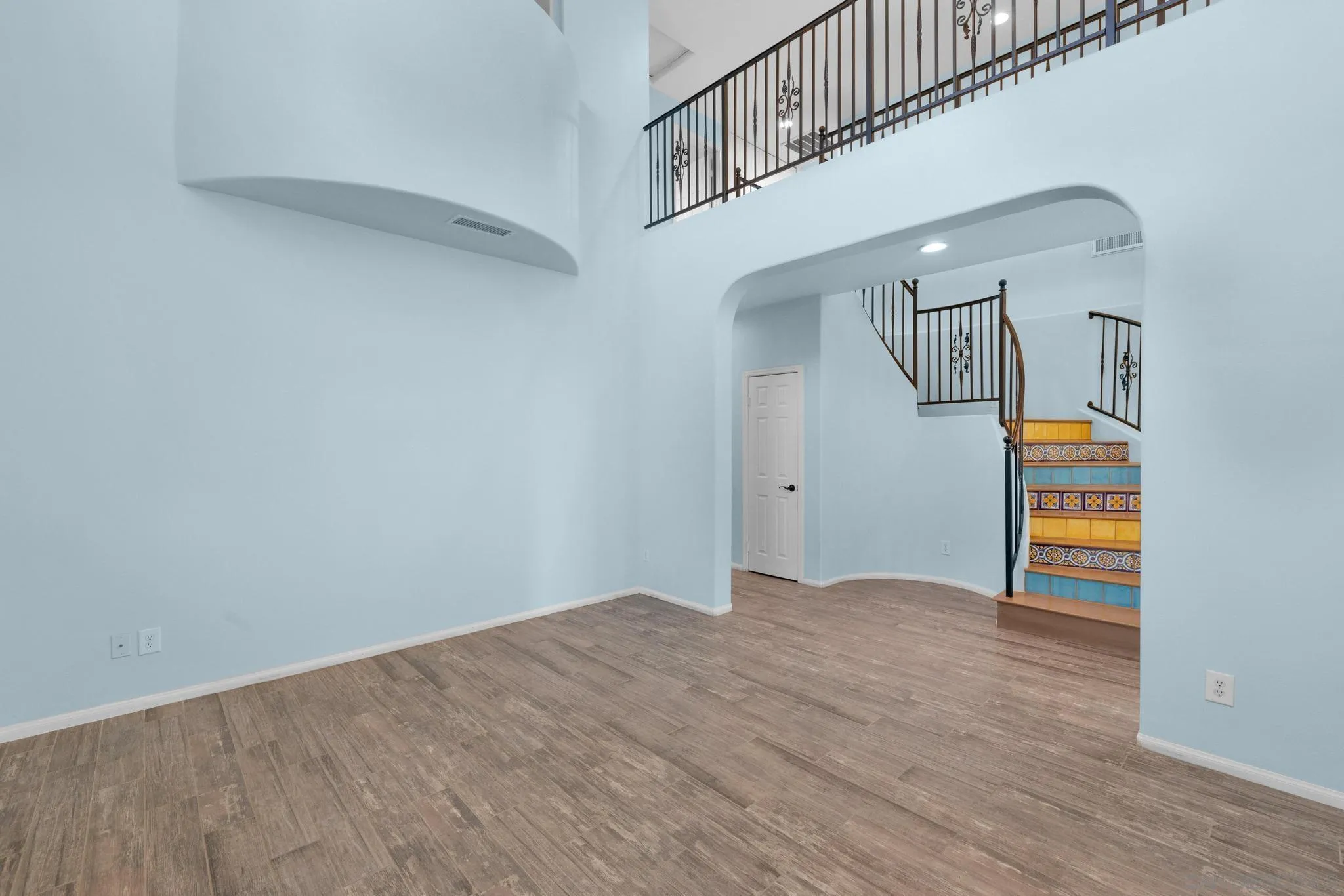 35140 Stirrup Road Temecula, CA 92592 - Photo 17 of 75 a view of empty room with stairs and wooden floor